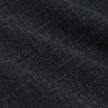 Nærbilde av det brettede stoffet på «Women Nara Pants Straight Grey Flint», som viser en tydelig vevestruktur.