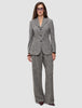 En kvinne i en grå blazer med fiskebensmønster og matchende Women Ashryn Pants Wide Domino Herringbone.