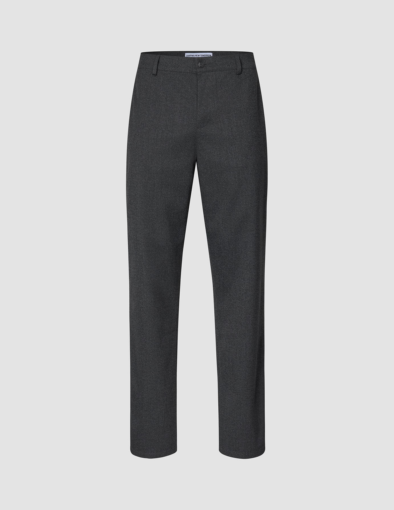 Atelier-bukser i mørkegrått, med avslappet passform, brutt twill og knappelukking, i en ren skandinavisk stil.