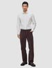 En mann iført en Elevated Shirt Regular Light Grey Striped, kombinert med mørke bukser og loafers.