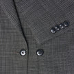 Nærbilde av en Women Nara Blazer Fitted Black Check i svart-hvitt rutemønster med svarte knapper.